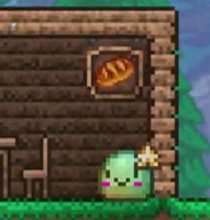 A bread item in an Item Frame and the rainbow town slime.