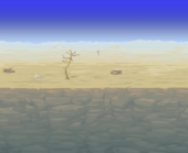Dry flat desert over a cliff, with a few dead trees and bones